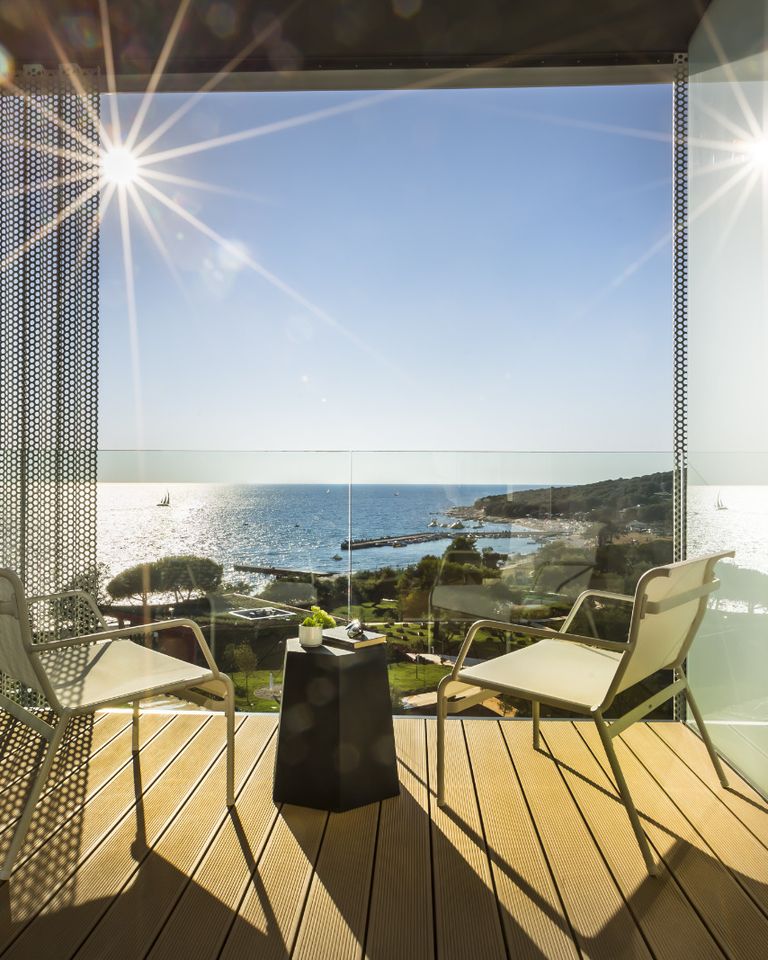 Hotel balcony with a sea view in soft evening light