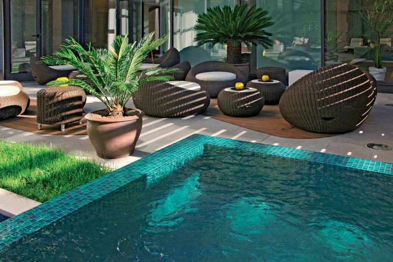 Poolside terrace with loungers at a coastal hotel