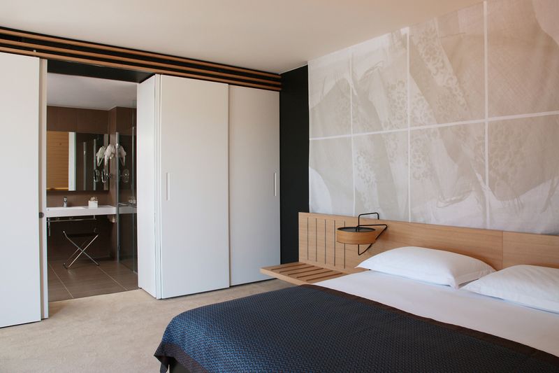 Minimal hotel bedroom with natural light